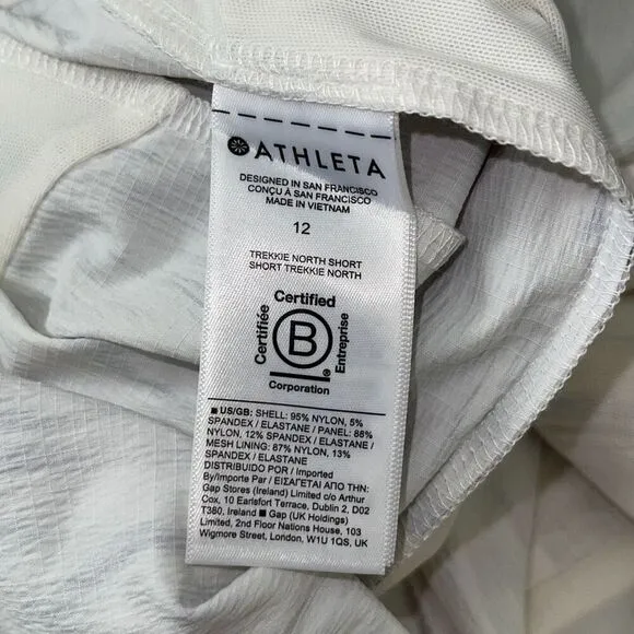 Athleta Athletic Trekkie North Shorts Off White Print Stretch Zip Pockets 12