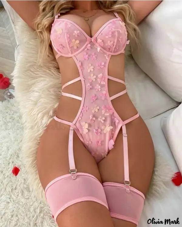 Garter in transparent cut-out mesh with floral decoration