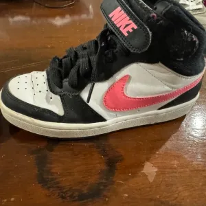 Nike mid top black white and pink 4Y like new