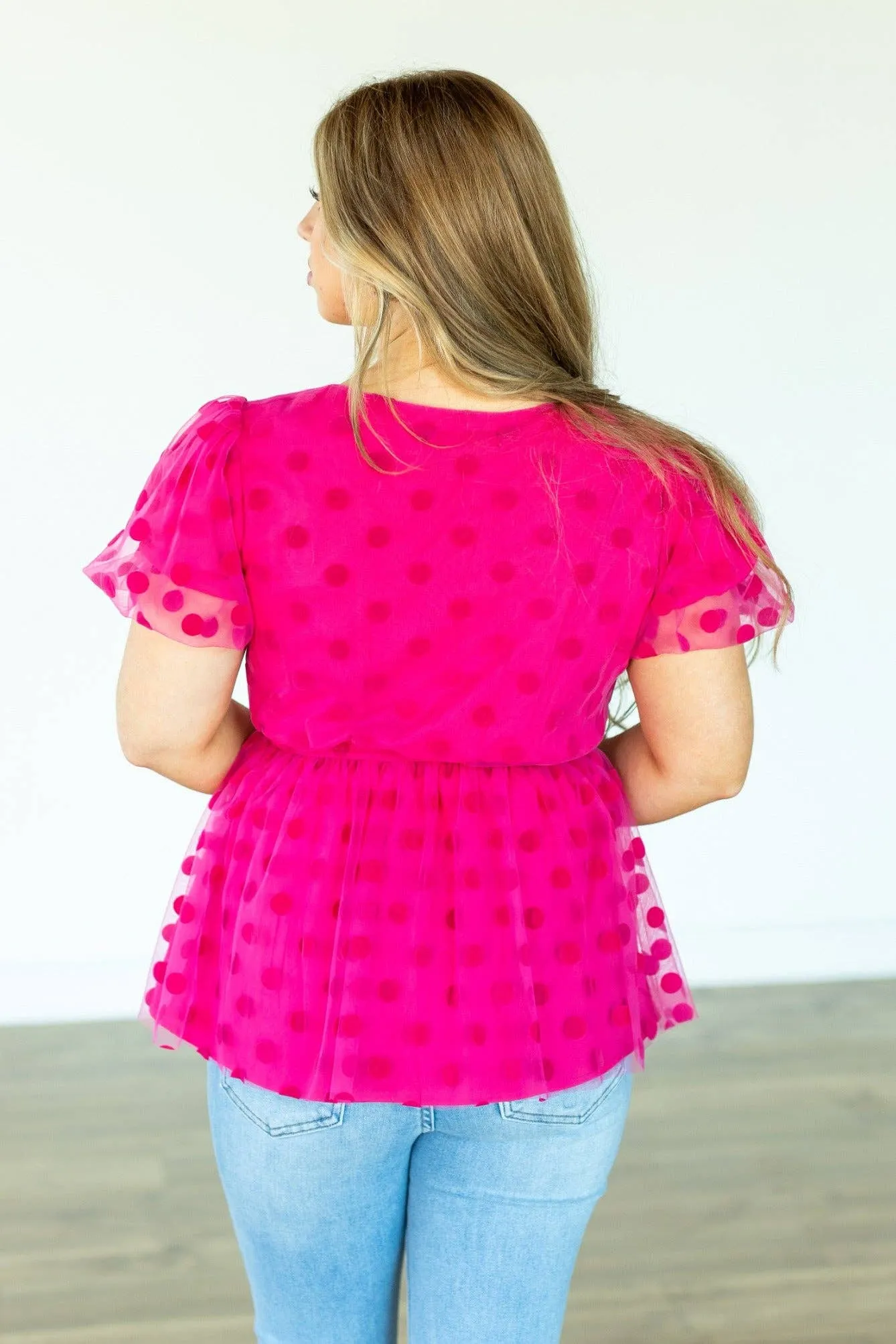 Pink polka dot mesh peplum top