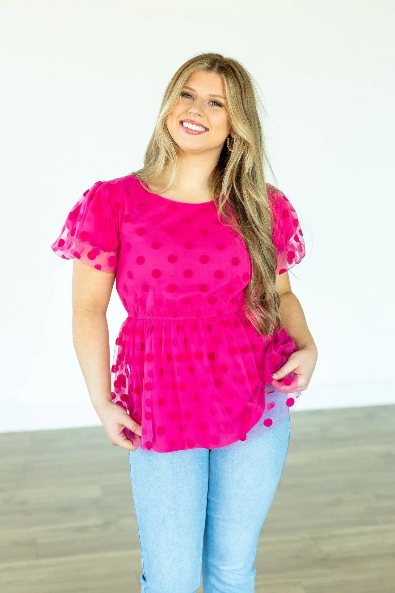 Pink polka dot mesh peplum top