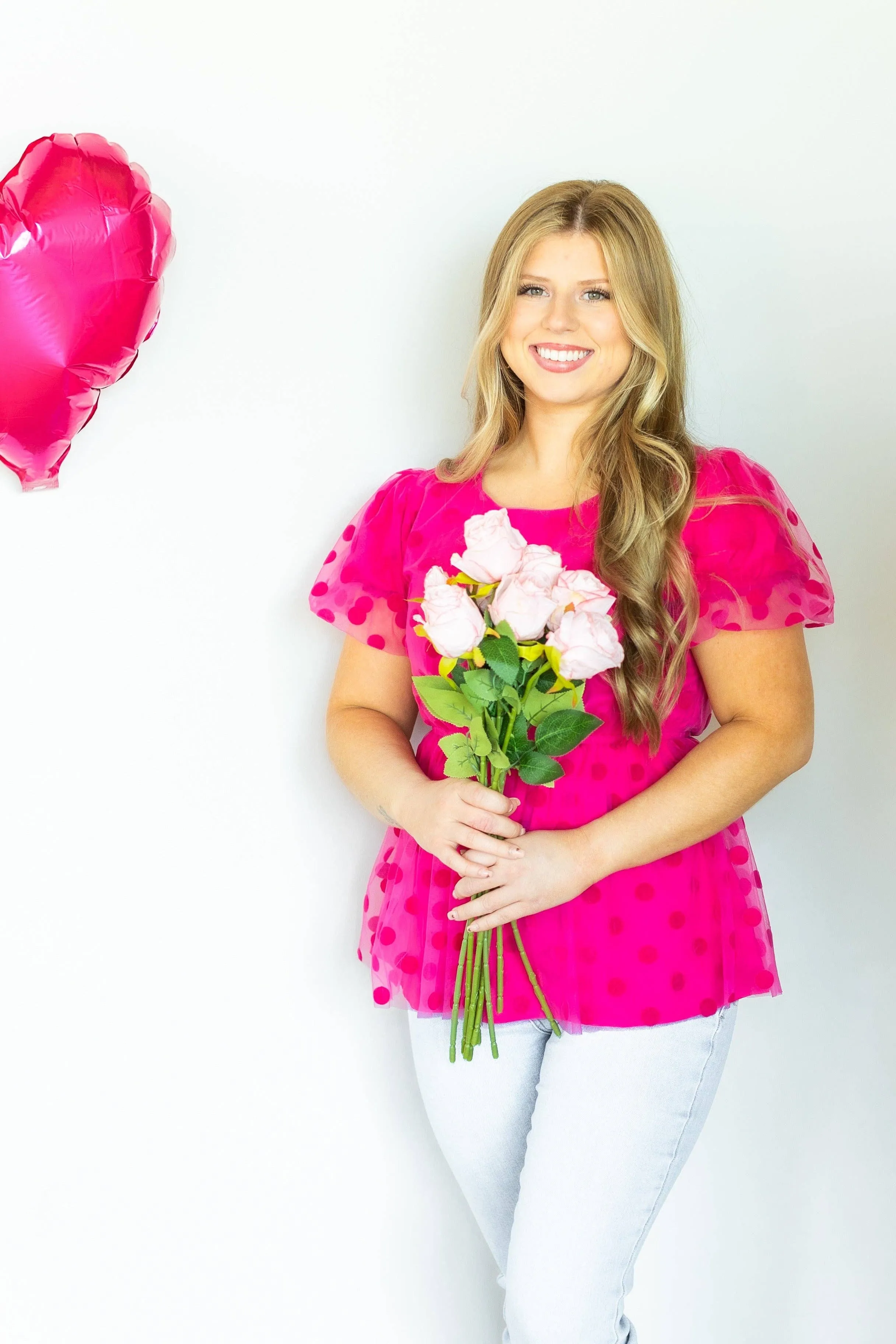 Pink polka dot mesh peplum top