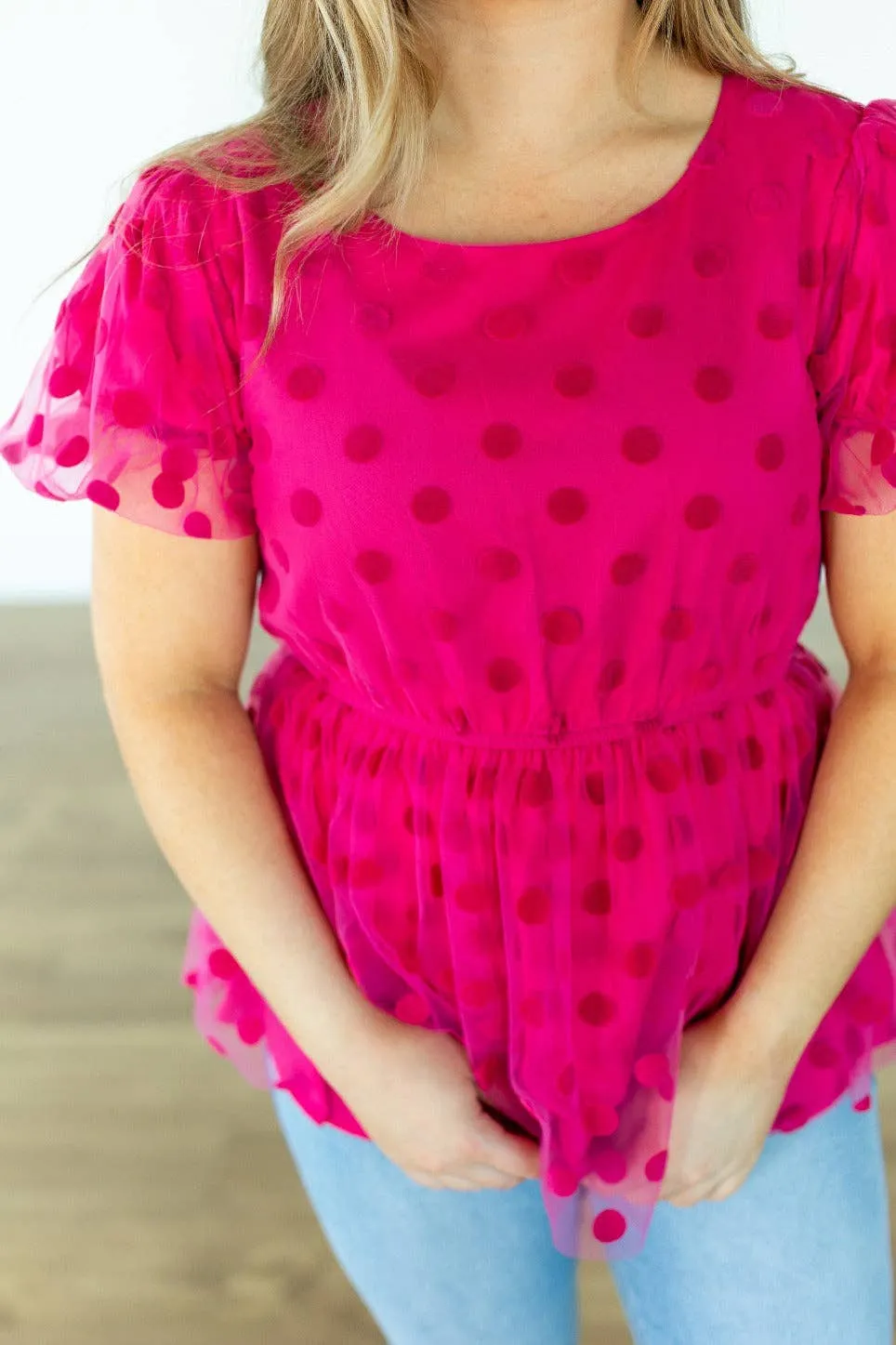 Pink polka dot mesh peplum top