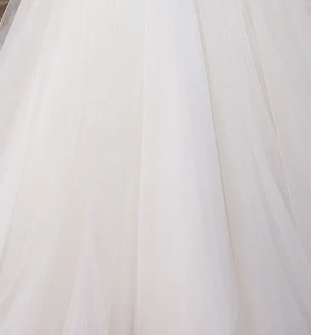 Sexy See Through Bodice Romantic Wedding Dress With Lace Appliques And Ruffled Skirt